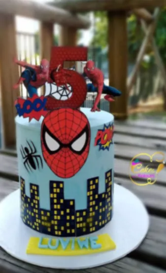 Sky blue 1-tier cake with soft icing, Spider-Man character printouts, and a web-patterned number 5 topper Sky blue 1-tier cake with soft icing, Spider-Man character printouts, and a web-patterned number 5 topper