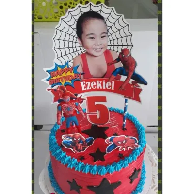 Red 1-tier soft icing birthday cake with blue piped borders, Spiderman printouts, and a custom photo topper Red 1-tier soft icing birthday cake with blue piped borders, Spiderman printouts, and a custom photo topper