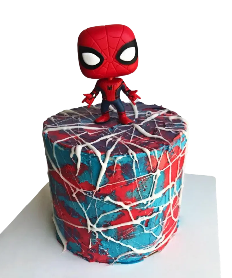 Red and blue 1-tier soft icing birthday cake with a Spider-Man Funko Pop toy topper and white piped spider web icing Red and blue 1-tier soft icing birthday cake with a Spider-Man Funko Pop toy topper and white piped spider web icing