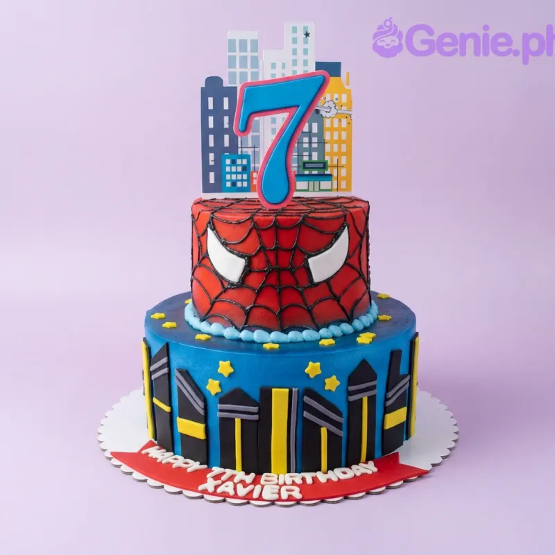 A red and blue two-tier cake themed Spiderman and city skyline, with a large blue number 7 topper and city building panels. A red and blue two-tier cake themed Spiderman and city skyline, with a large blue number 7 topper and city building panels.