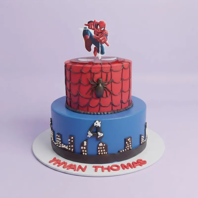 A red and blue two-tier cake themed around Spiderman, featuring a Spiderman printout topper, black web designs, and a city skyline. A red and blue two-tier cake themed around Spiderman, featuring a Spiderman printout topper, black web designs, and a city skyline.