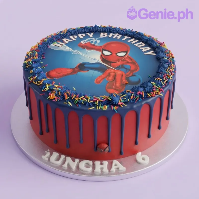 Blue and red 1 tier birthday cake with soft icing, spiderman photo top, blue drip, and colorful sprinkles Blue and red 1 tier birthday cake with soft icing, spiderman photo top, blue drip, and colorful sprinkles