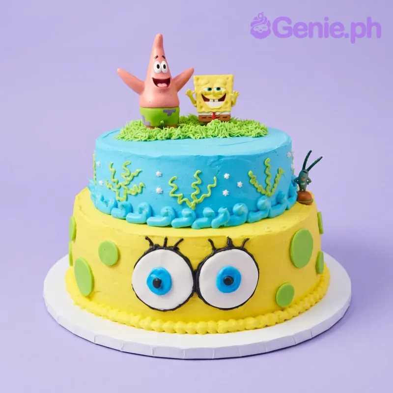 A blue and yellow two-tier Spongebob Squarepants cake, featuring Spongebob and Patrick toppers, with piped seaweed. A blue and yellow two-tier Spongebob Squarepants cake, featuring Spongebob and Patrick toppers, with piped seaweed.