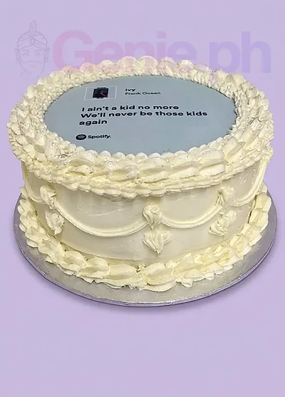 A white 1-tier cake themed Spotify Lyric, featuring a Frank Ocean Ivy Spotify printout and piped icing ruffles. A white 1-tier cake themed Spotify Lyric, featuring a Frank Ocean Ivy Spotify printout and piped icing ruffles.