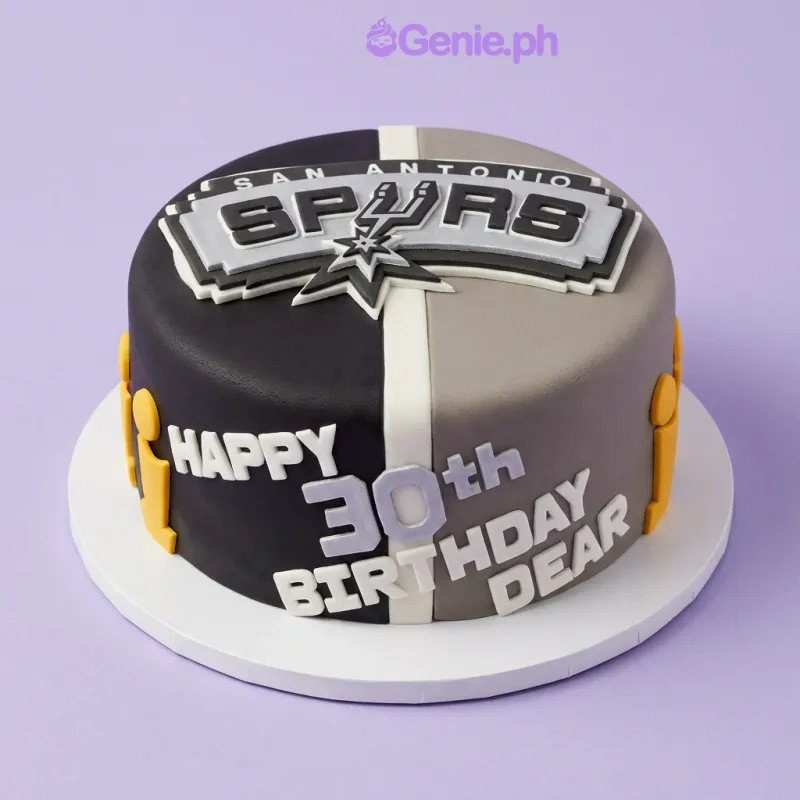 Black and grey 1-tier fondant cake with San Antonio Spurs logo topper and yellow trophy accents Black and grey 1-tier fondant cake with San Antonio Spurs logo topper and yellow trophy accents