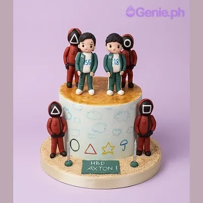 Squid Game themed 1-tier cake with fondant character toppers and geometric shapes Squid Game themed 1-tier cake with fondant character toppers and geometric shapes