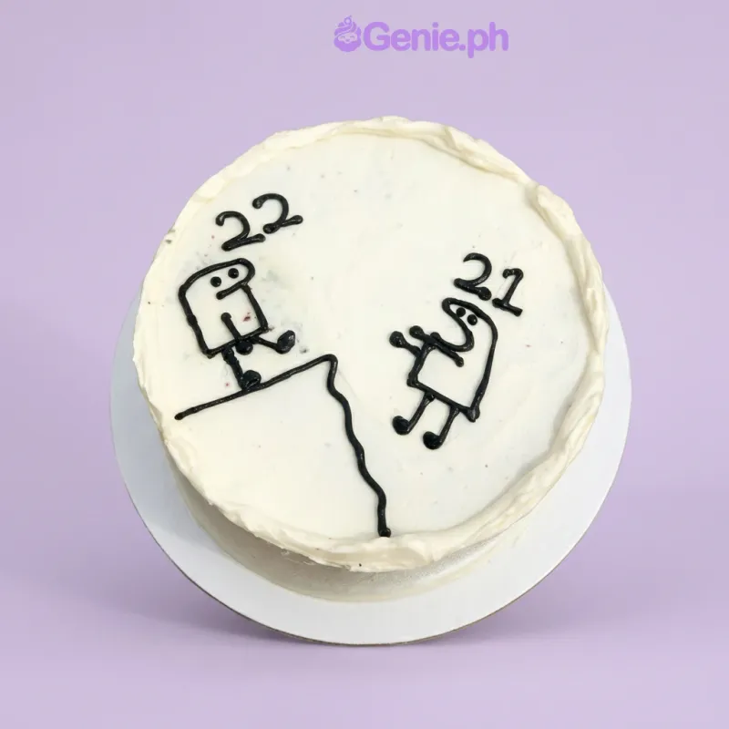 White 1-tier cake with black piped stick figure drawings and numbers 21 and 22 on top White 1-tier cake with black piped stick figure drawings and numbers 21 and 22 on top