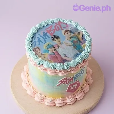 A blue, pink, and yellow 1-tier cake themed around Stray Kids Kpop, featuring an edible group photo print and icing rosettes with side cutouts. A blue, pink, and yellow 1-tier cake themed around Stray Kids Kpop, featuring an edible group photo print and icing rosettes with side cutouts.