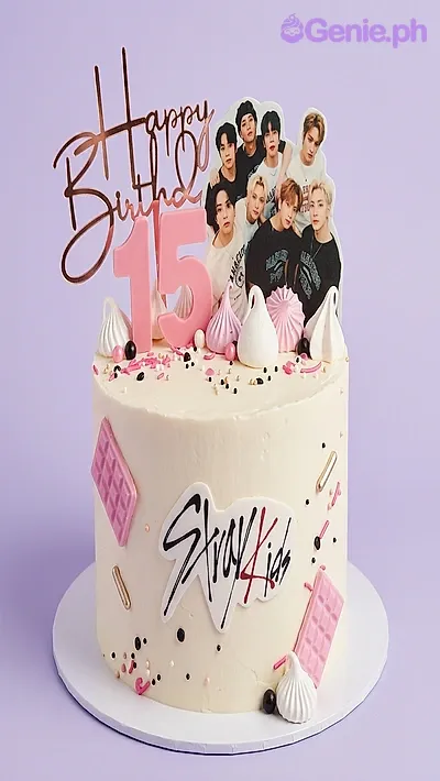 White 1-tier birthday cake with Stray Kids printed photo topper and pink chocolate bar accents White 1-tier birthday cake with Stray Kids printed photo topper and pink chocolate bar accents