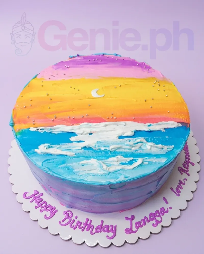 A multicolor 1-Tier cake with a Sunset Beach theme, featuring an icing moon, silver dragee stars, and palette knife waves. A multicolor 1-Tier cake with a Sunset Beach theme, featuring an icing moon, silver dragee stars, and palette knife waves.