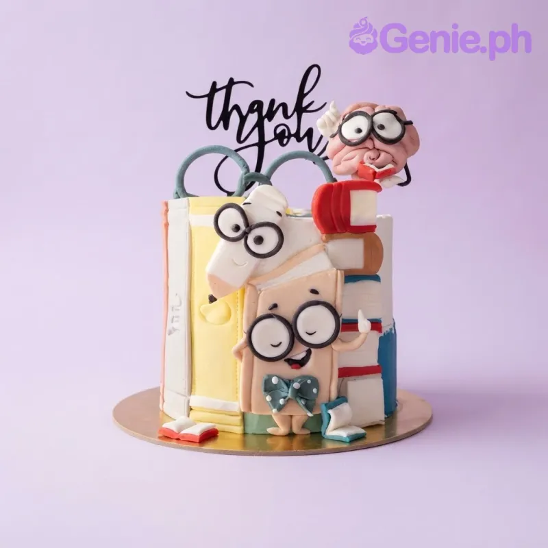 Ivory 1-tier fondant cake with smooth icing, a Teachers Day theme, book characters, and stacked books Ivory 1-tier fondant cake with smooth icing, a Teachers Day theme, book characters, and stacked books