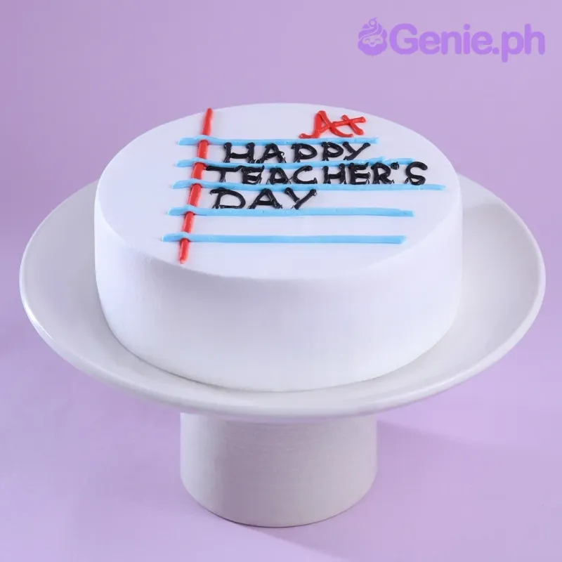 White minimalist cake for Teacher's Day with blue notebook lines and red margin icing design. White minimalist cake for Teacher's Day with blue notebook lines and red margin icing design.