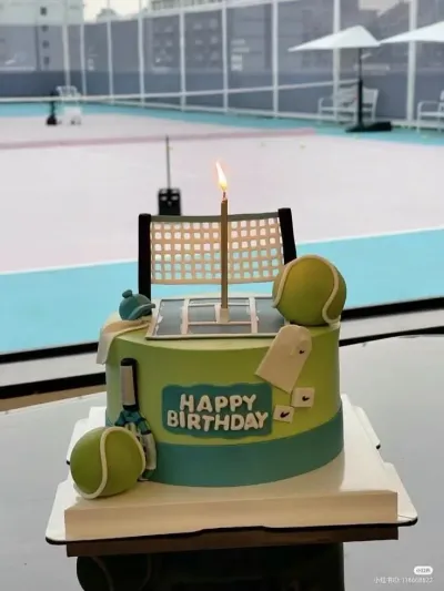 Light green 1-tier soft icing cake with a tennis net topper, fondant tennis balls, and a happy birthday sign Light green 1-tier soft icing cake with a tennis net topper, fondant tennis balls, and a happy birthday sign