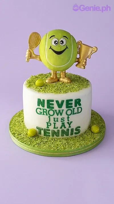 A white and green 1 Tier Fondant tennis cake, featuring a 3D tennis ball character, racket, trophy, and tennis balls. A white and green 1 Tier Fondant tennis cake, featuring a 3D tennis ball character, racket, trophy, and tennis balls.