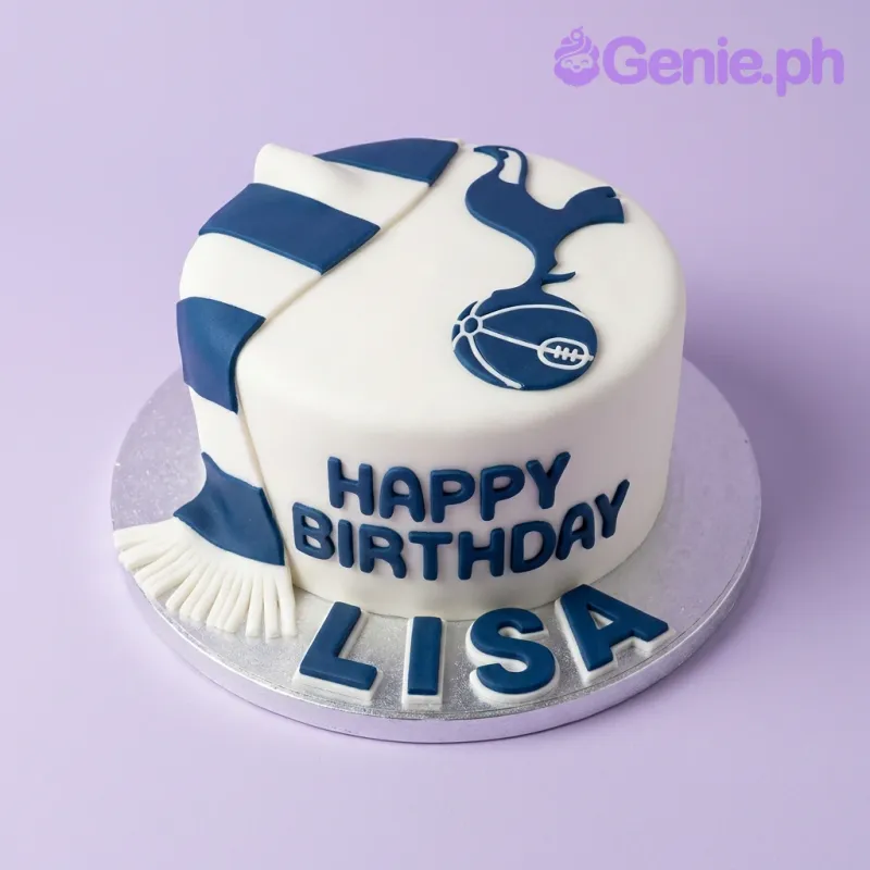 White single tier cake with navy blue Tottenham Hotspur logo and scarf design with Happy Birthday message White single tier cake with navy blue Tottenham Hotspur logo and scarf design with Happy Birthday message