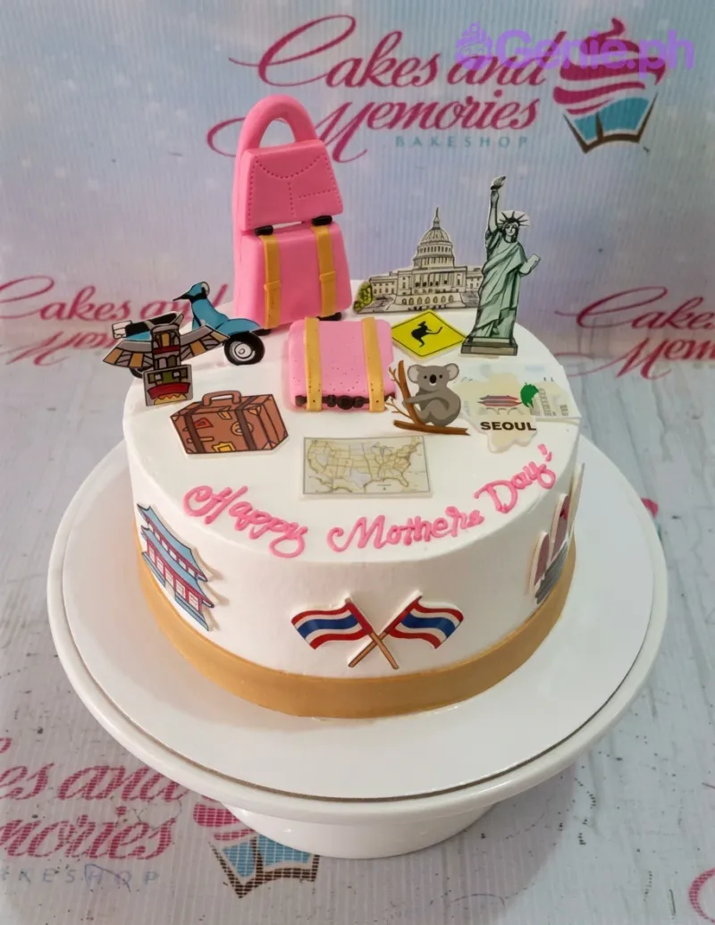 A white 1-tier Travel Mother's Day cake with pink luggage, landmark printouts, and a 'Happy Mother's Day' message. A white 1-tier Travel Mother's Day cake with pink luggage, landmark printouts, and a 'Happy Mother's Day' message.