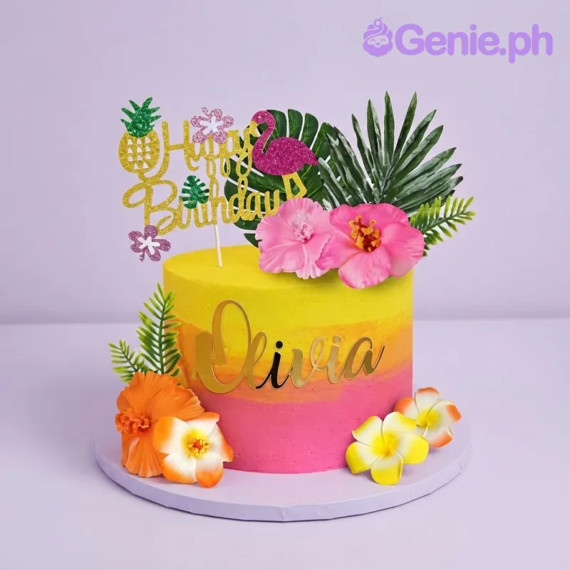 Yellow and pink gradient 1-tier birthday cake with tropical palm leaves, vibrant hibiscus flowers, and a gold glitter Happy Birthday topper Yellow and pink gradient 1-tier birthday cake with tropical palm leaves, vibrant hibiscus flowers, and a gold glitter Happy Birthday topper