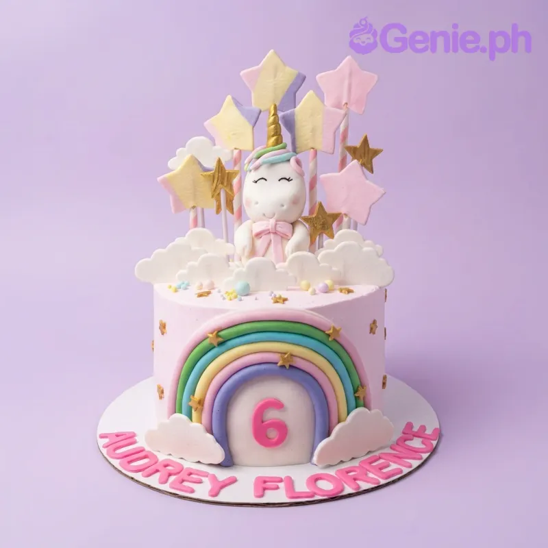A pink 1-tier cake themed around Unicorn, featuring a fondant unicorn, rainbow arch, pastel stars, and clouds. A pink 1-tier cake themed around Unicorn, featuring a fondant unicorn, rainbow arch, pastel stars, and clouds.