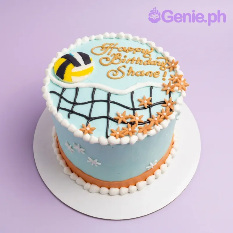 A light blue 1 Tier volleyball-themed cake, featuring a volleyball topper, piped net design, orange flowers, and 'Happy Birthday Shane!' text. A light blue 1 Tier volleyball-themed cake, featuring a volleyball topper, piped net design, orange flowers, and 'Happy Birthday Shane!' text.