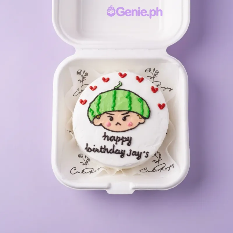 White bento cake with a piped watermelon boy face and red hearts for a birthday White bento cake with a piped watermelon boy face and red hearts for a birthday