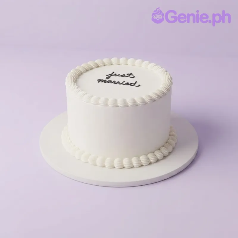 White 1-tier soft icing wedding cake with piped shell borders and black script text White 1-tier soft icing wedding cake with piped shell borders and black script text