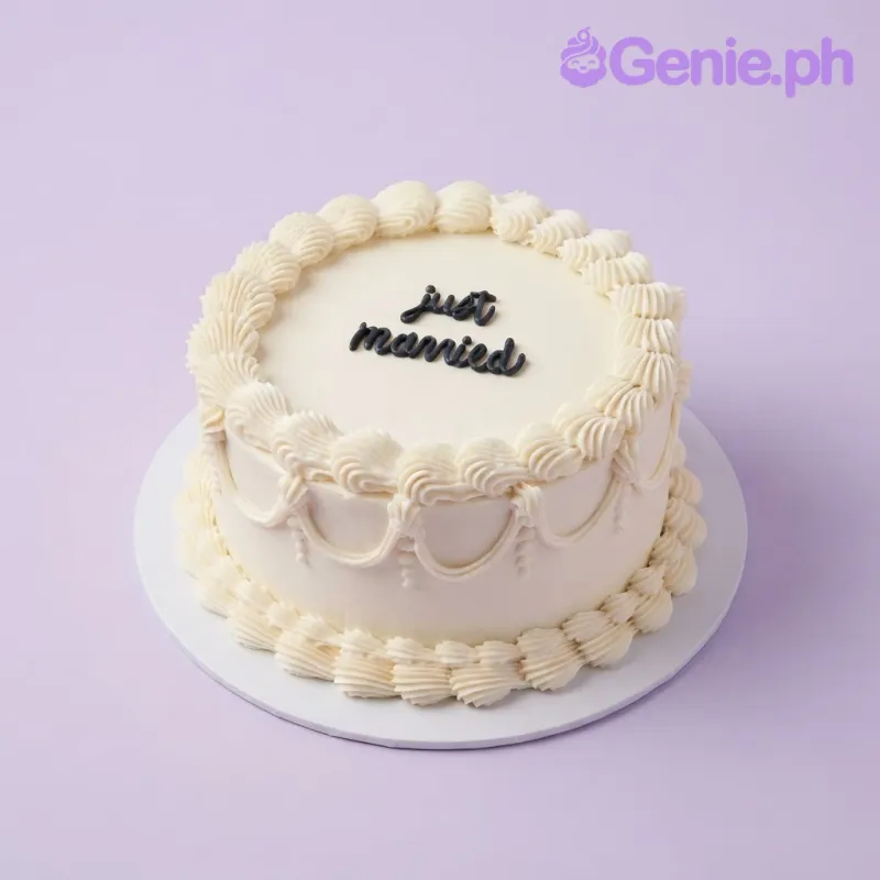 White 1-tier soft icing cake with piped shell borders and black piped just married script White 1-tier soft icing cake with piped shell borders and black piped just married script