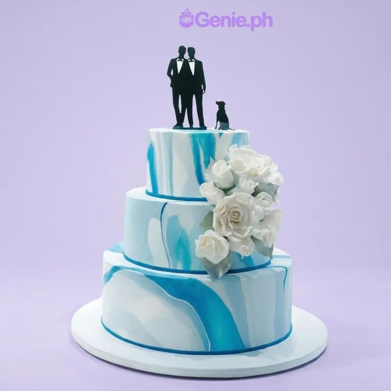 3-tier marbled blue and white fondant wedding cake with black silhouette topper and white gumpaste roses 3-tier marbled blue and white fondant wedding cake with black silhouette topper and white gumpaste roses