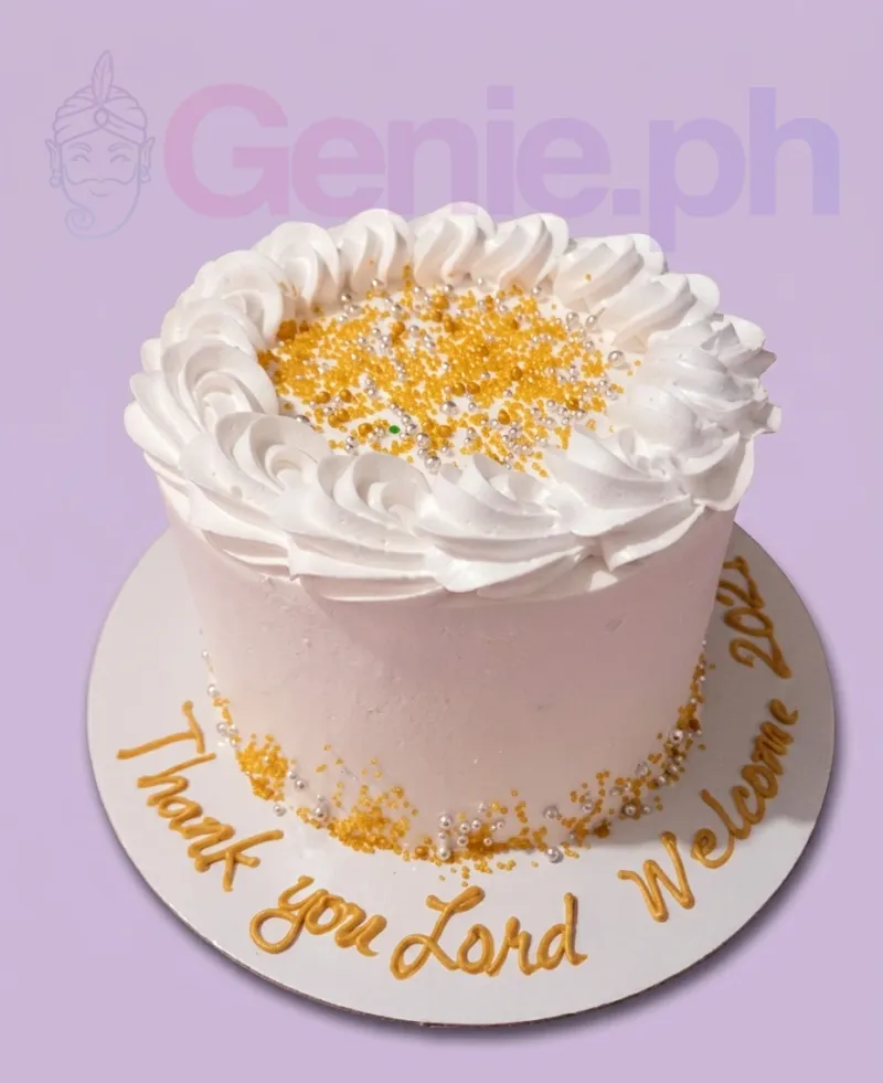 A white 1-tier minimalist cake featuring white icing rosettes, gold and silver sprinkles, and a gold message on the base board. A white 1-tier minimalist cake featuring white icing rosettes, gold and silver sprinkles, and a gold message on the base board.