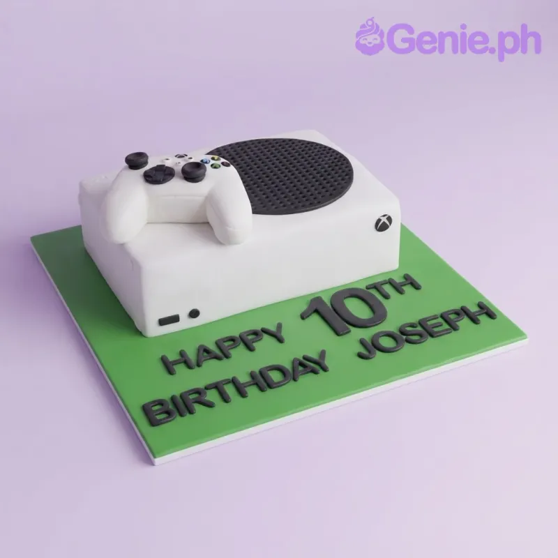White rectangle fondant cake with smooth icing, an Xbox controller topper, and a green base board White rectangle fondant cake with smooth icing, an Xbox controller topper, and a green base board