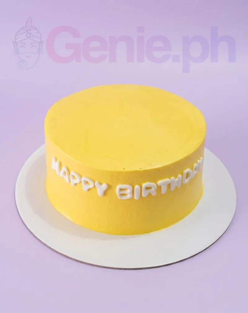 A yellow and white 1-tier cake themed around minimalism, featuring white gumpaste letters saying "HAPPY BIRTHDAY" on the side. A yellow and white 1-tier cake themed around minimalism, featuring white gumpaste letters saying "HAPPY BIRTHDAY" on the side.