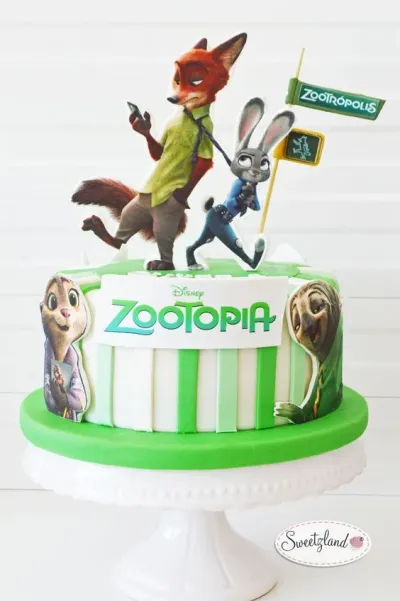 A green and white 1-tier fondant cake themed around Zootopia, featuring Nick Wilde and Judy Hopps toppers and vertical green stripes. A green and white 1-tier fondant cake themed around Zootopia, featuring Nick Wilde and Judy Hopps toppers and vertical green stripes.