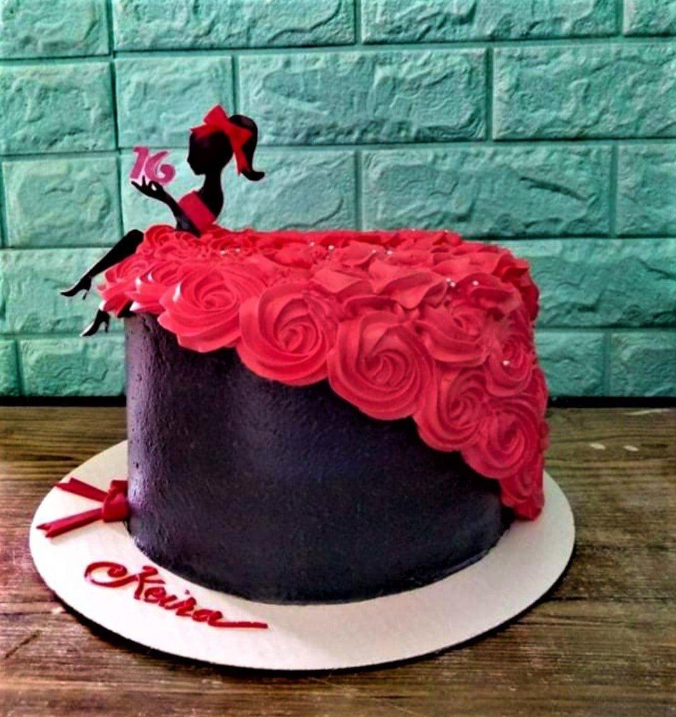 Black and red 16th birthday cake featuring a silhouette girl topper with a red icing rosette dress and silver dragees.