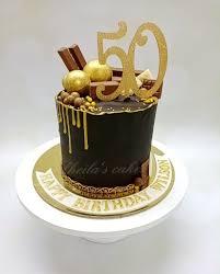 Cake 1 Tier - gold, dark, white theme with gold number 50 topper and gold sprinkles and small edible balls