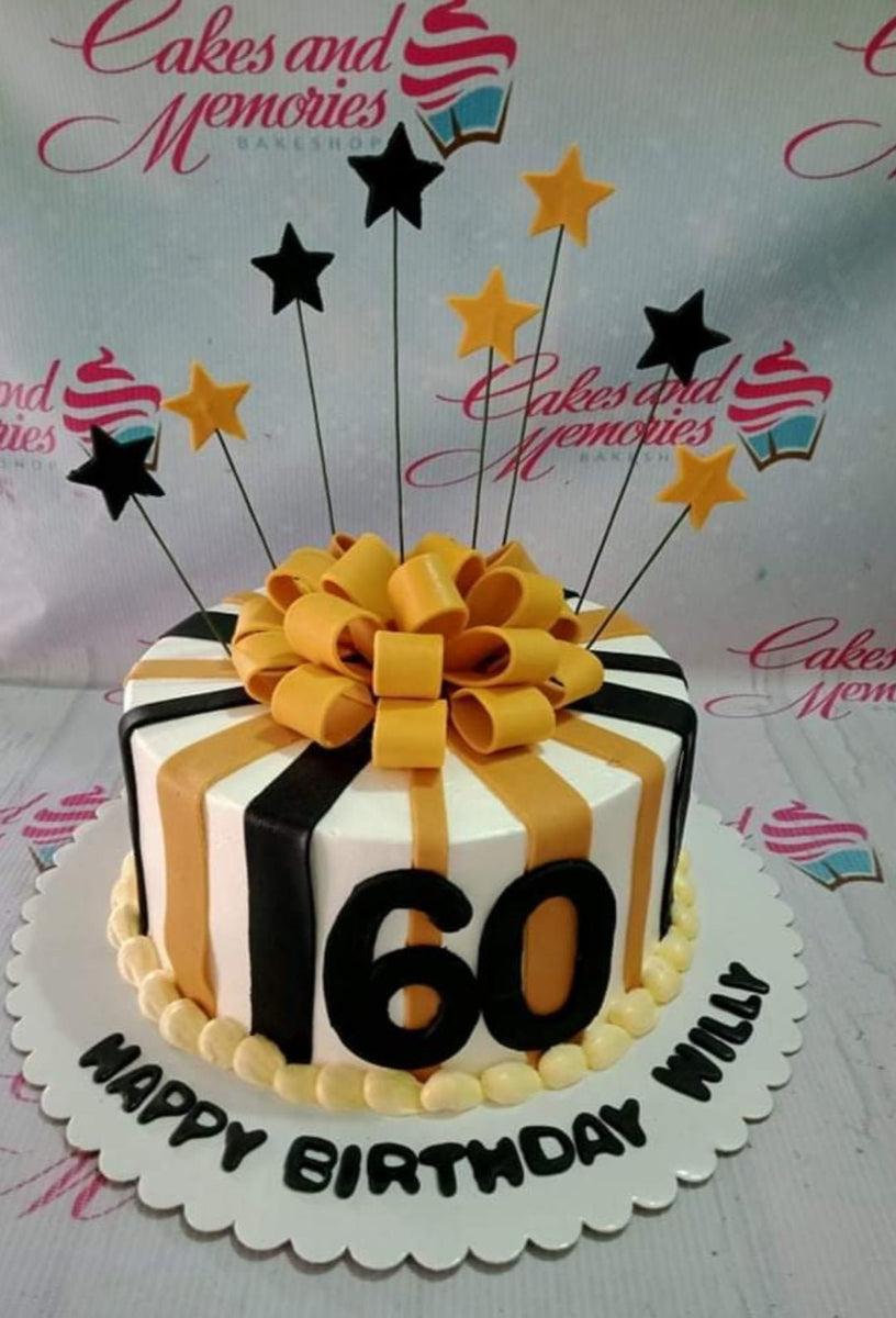 Black and gold striped 60th birthday cake with a large yellow fondant bow and star toppers on wires.