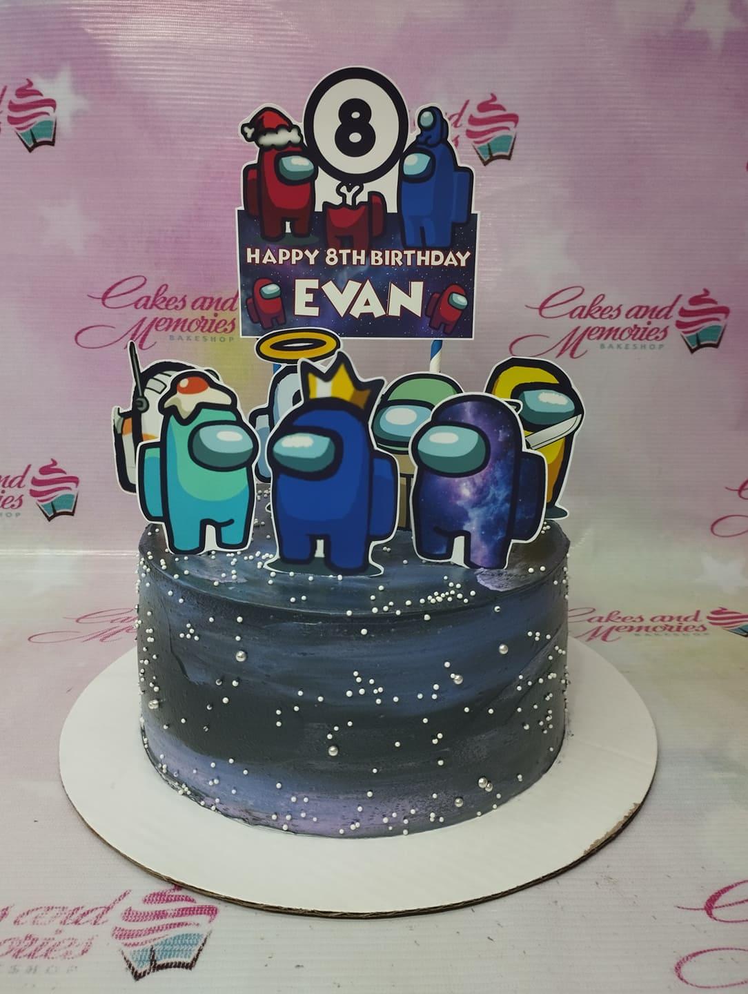 Among Us themed birthday cake with dark blue galaxy icing, silver sprinkles, and character printouts for Evan's 8th birthday.