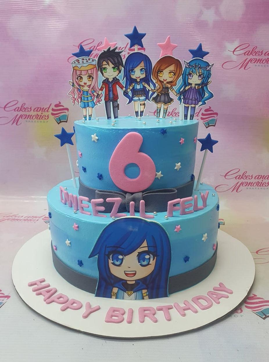 Two-tier light blue birthday cake featuring anime character printouts, a pink number 6 topper, and pink gumpaste lettering.