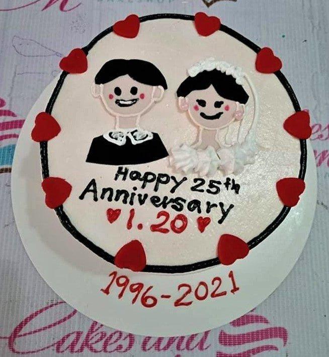 Bento cake for a 25th anniversary featuring hand-piped bride and groom figures with red hearts and a black border.