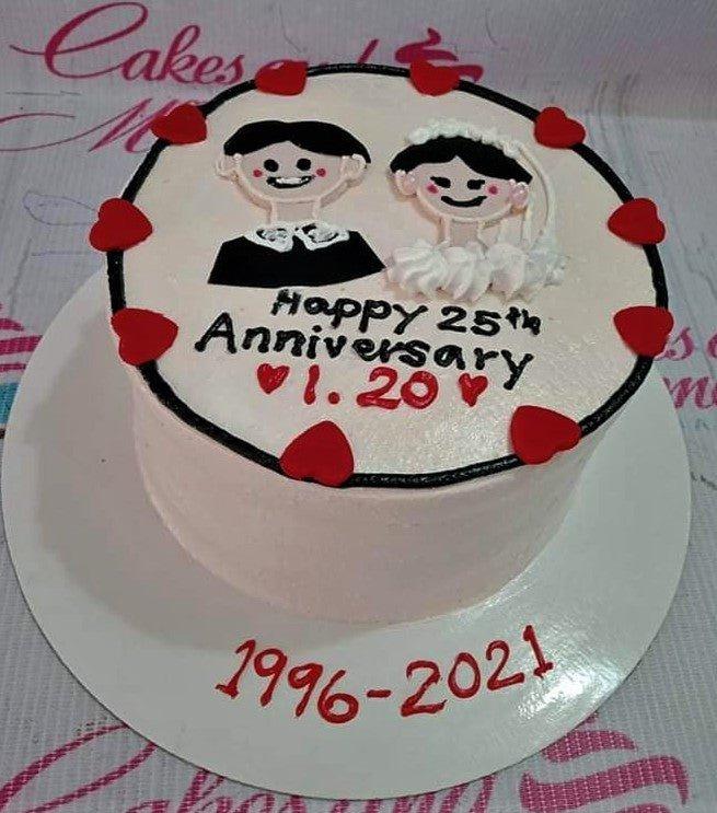 White minimalist anniversary cake with hand-drawn icing couple, red hearts, and black border.