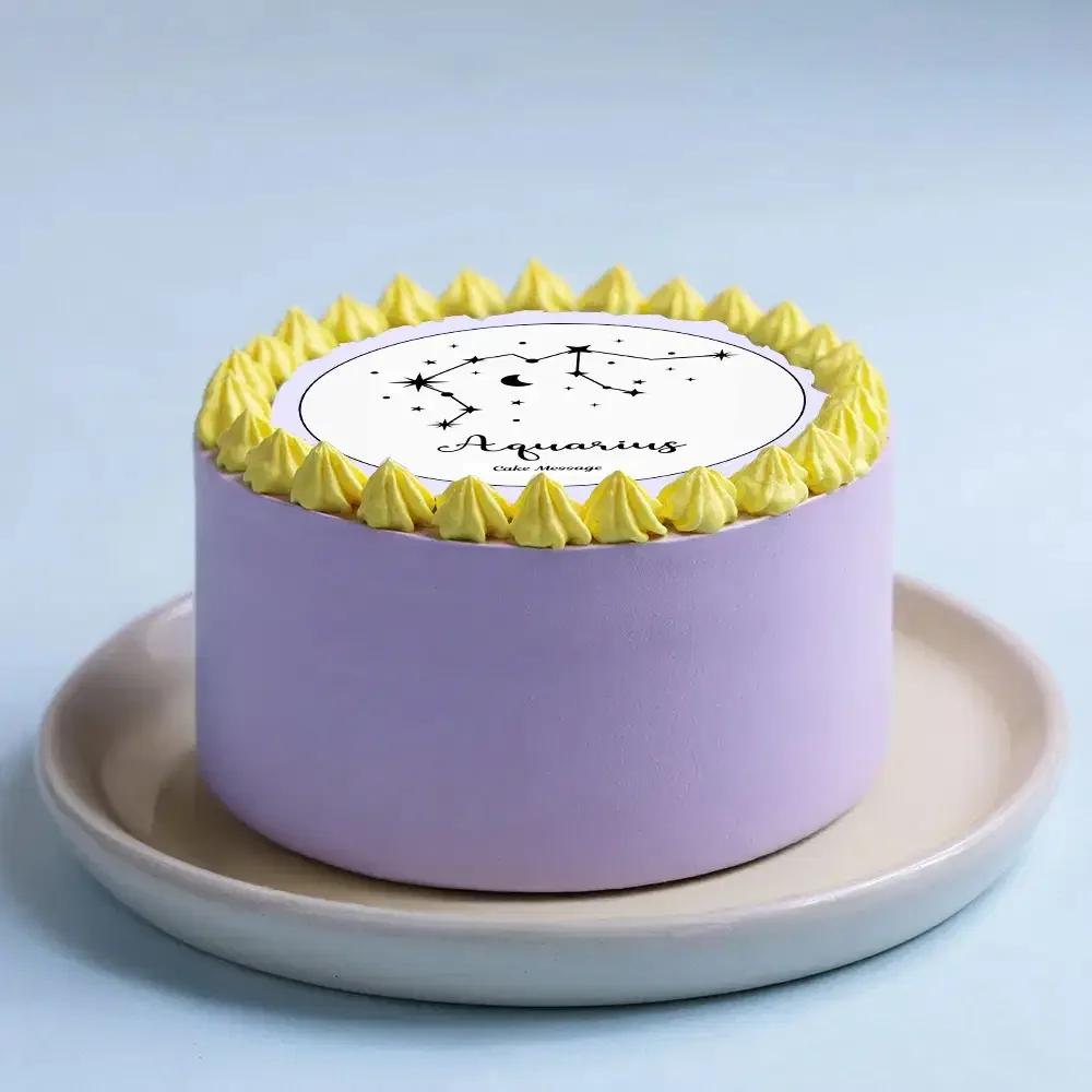 Minimalist lavender bento cake with yellow icing rosettes and an Aquarius constellation printout topper.