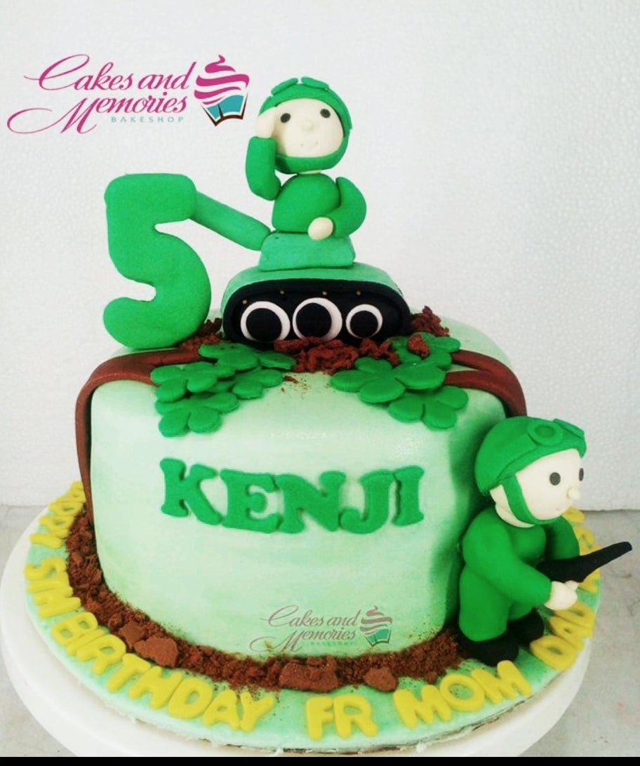 Green army tank themed birthday cake with fondant soldier figures and a large number 5 topper.