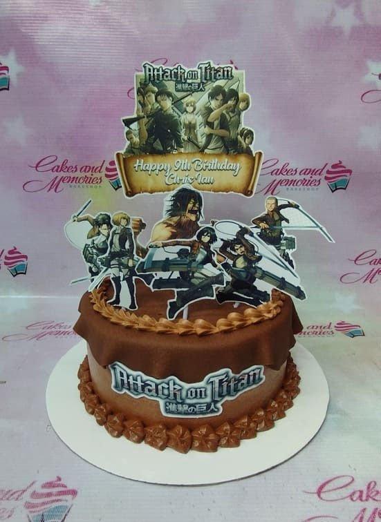 Attack on Titan themed chocolate cake with character printouts and a brown fondant drape design.
