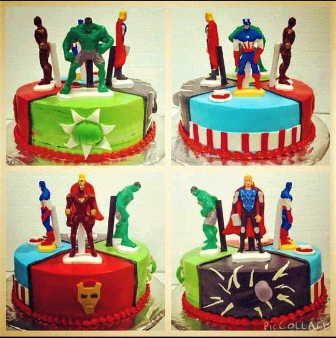 Avengers themed birthday cake with 3D superhero figures of Hulk, Captain America, Iron Man, and Thor on a multi-colored icing base.