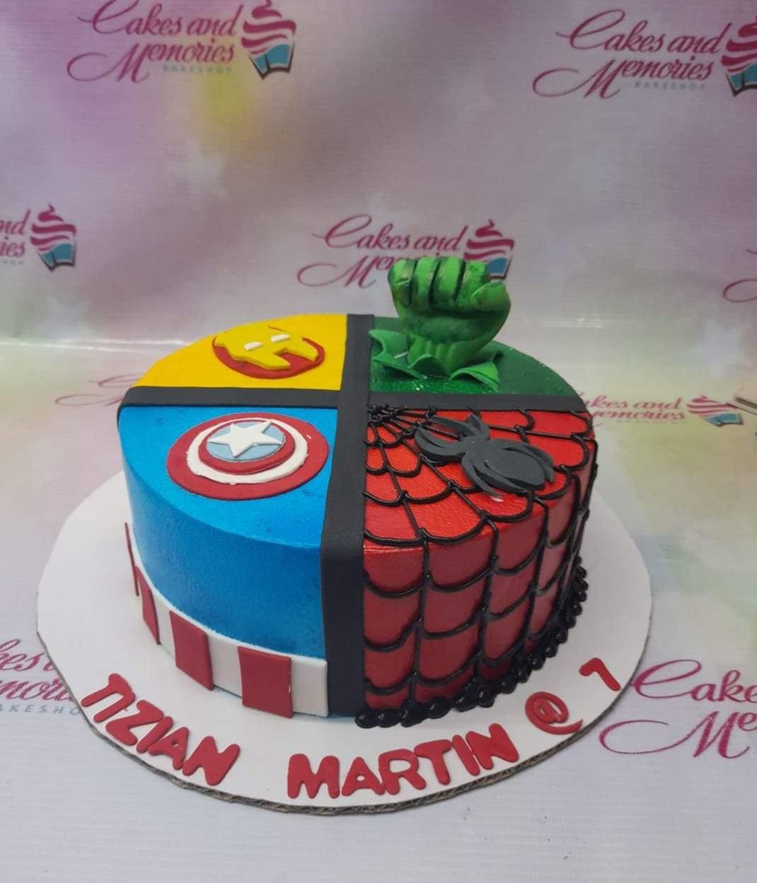 Avengers and Spider-Man themed birthday cake with Hulk fist, Iron Man, Captain America, and Spider-Man designs.