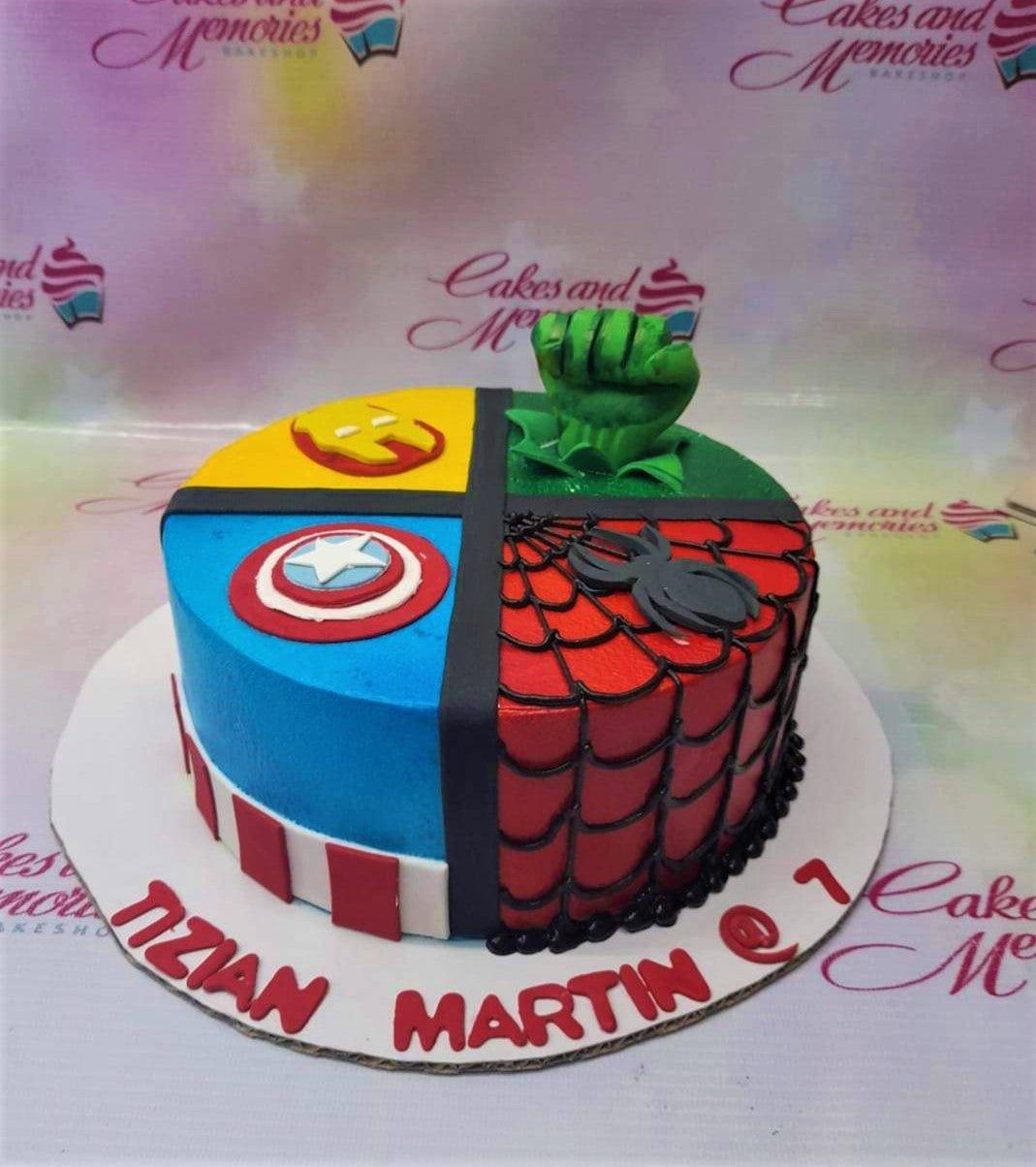 Avengers themed 1-tier fondant cake featuring Hulk, Iron Man, Captain America, and Spider-Man quadrants with a 3D Hulk fist topper.