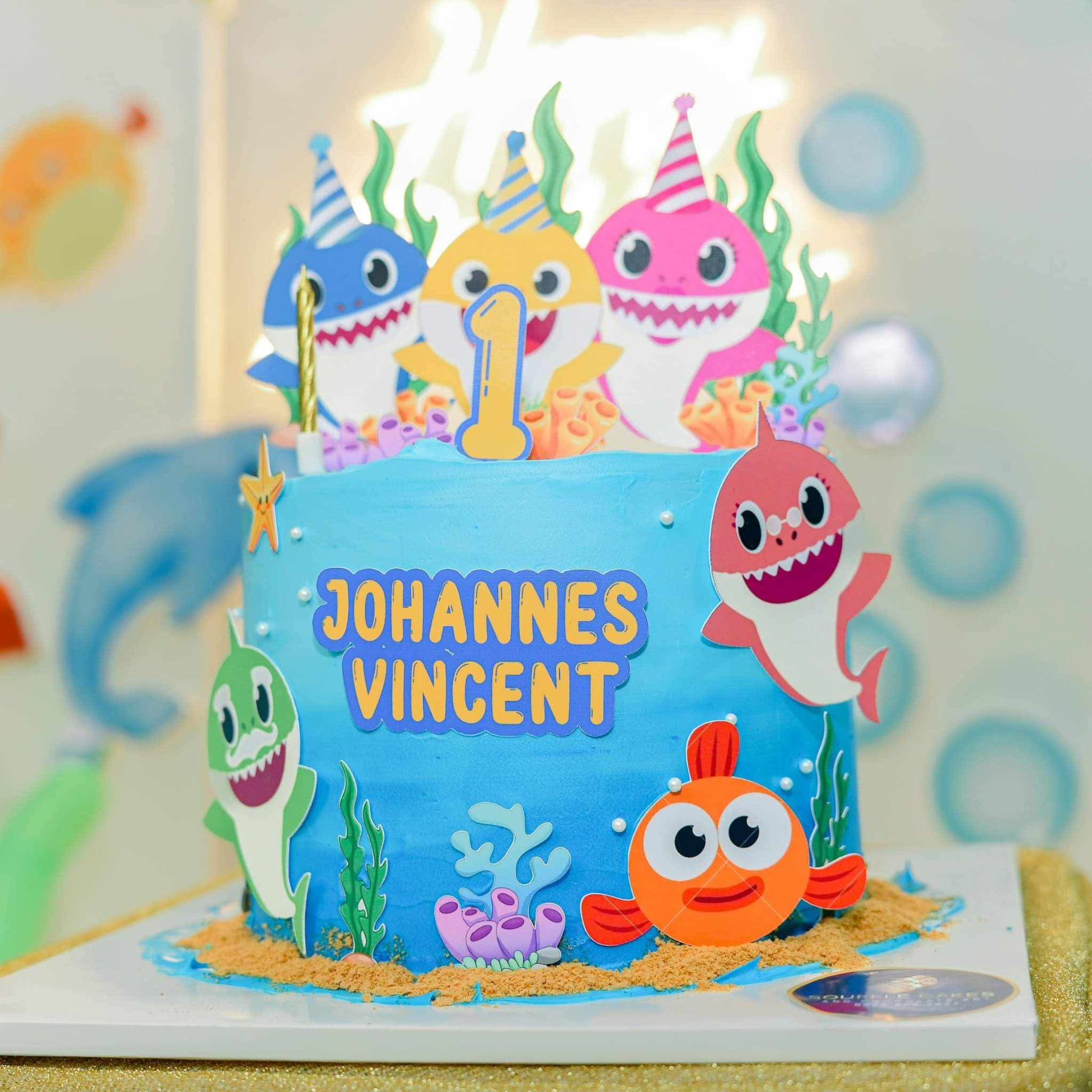 Baby Shark 1st Birthday 1 Tier - blue, yellow, pink theme with blue baby shark topper and pink baby shark side decoration