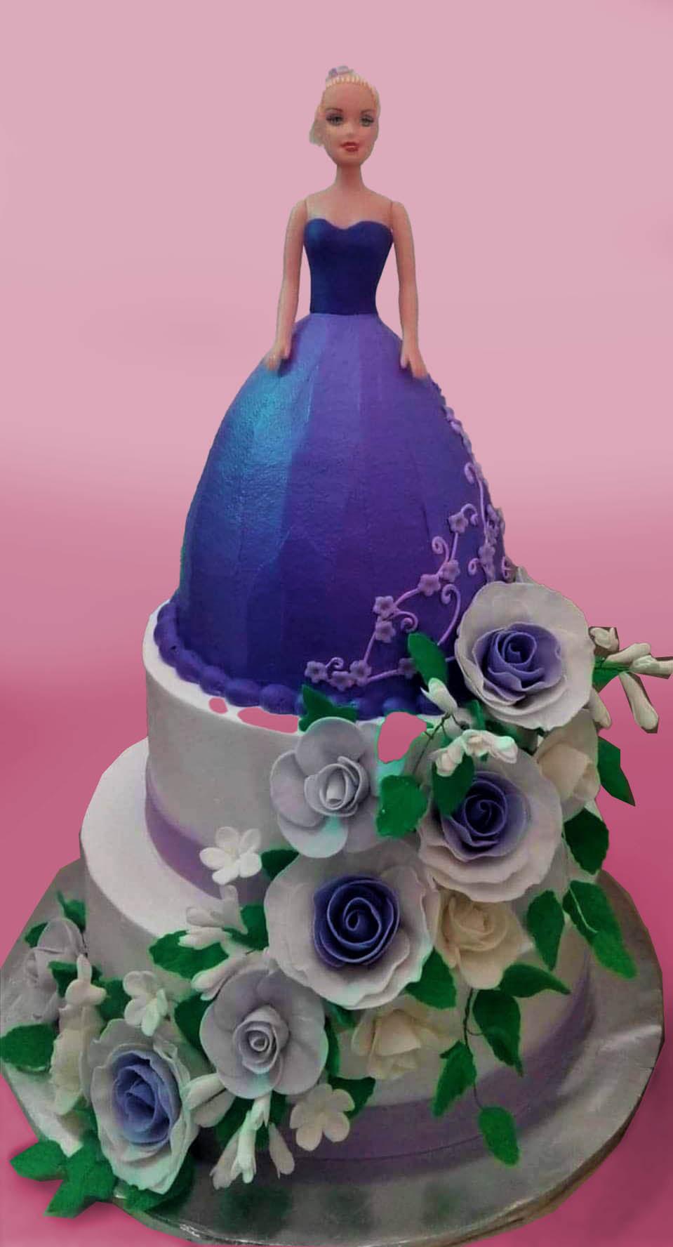 Three-tier Barbie doll cake with a purple ombre gown and white and purple edible roses cascading down the side.