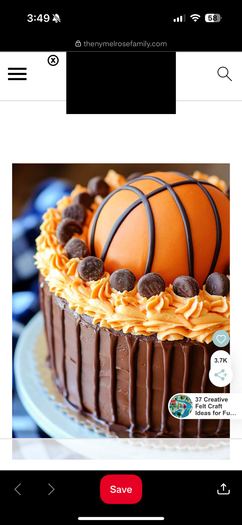 A brown and orange 1 tier cake featuring a half-sphere basketball and buttercream rosettes.