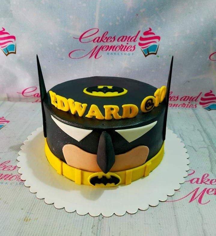 Batman themed birthday cake for Edward with a black fondant base, yellow utility belt, and Batman mask design.