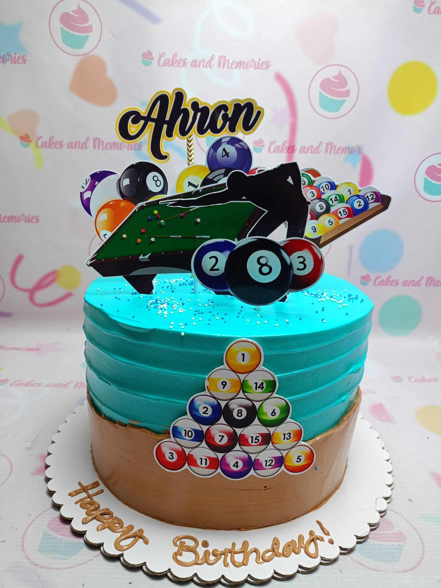 Billiards themed birthday cake with blue and brown icing, featuring pool table and billiard ball printouts for Ahron's birthday.