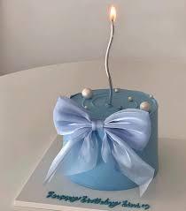 blue minimalist bow 1 Tier - silver, blue, light theme with tall wavy silver candle and white pearls